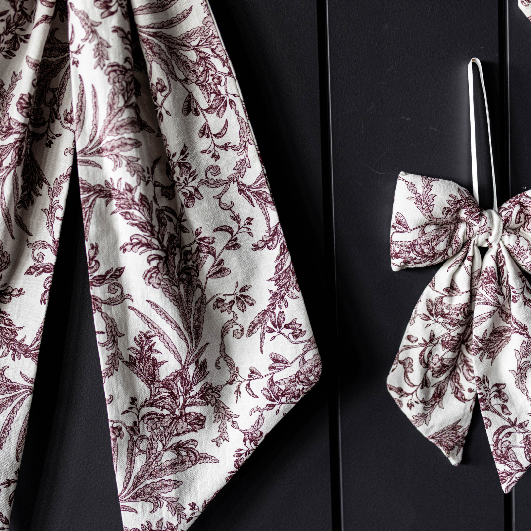 Bows Star Toile Burgundy Fabric