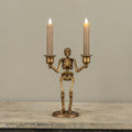 GOLD SKELETON TAPER CANDLE HOLDER