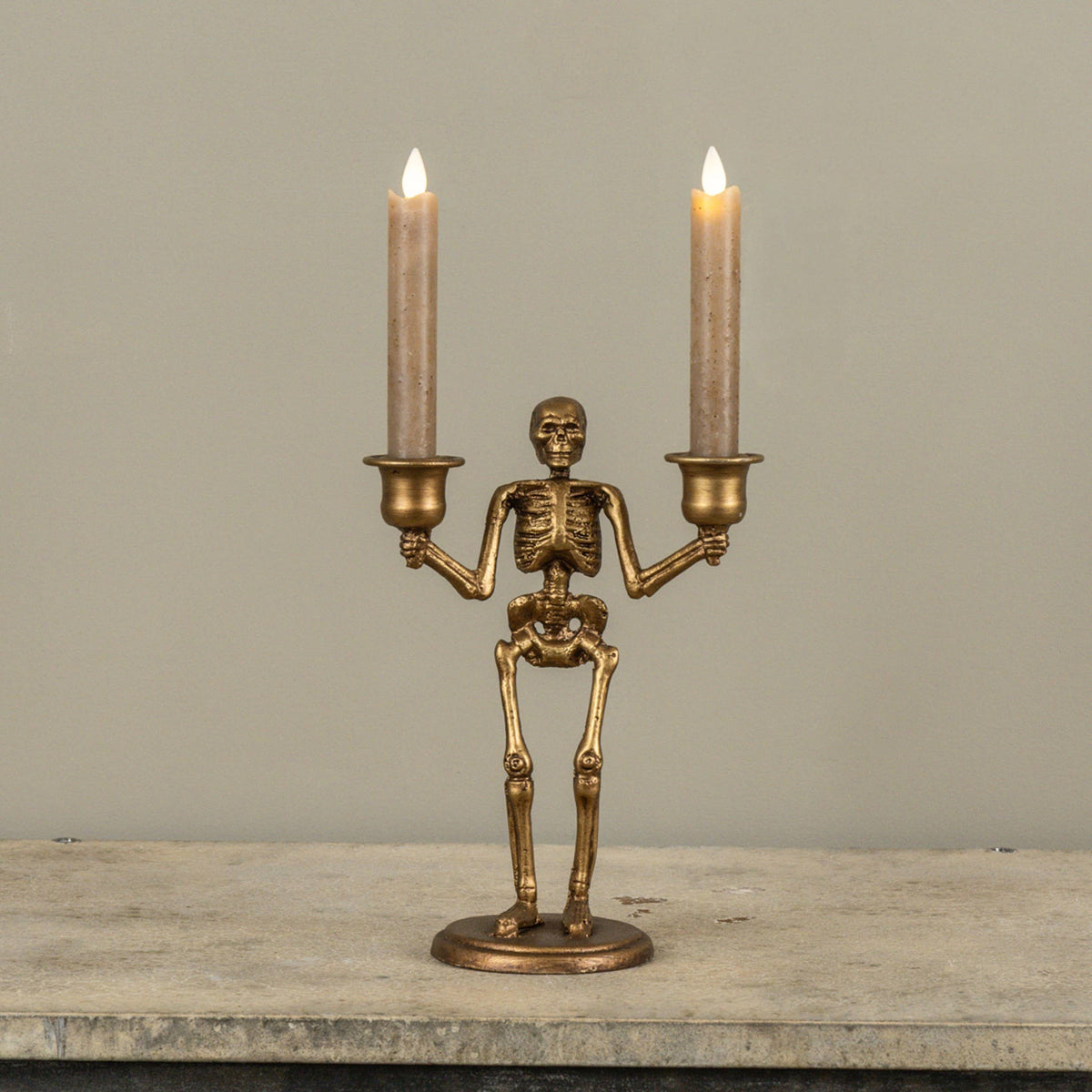 GOLD SKELETON TAPER CANDLE HOLDER